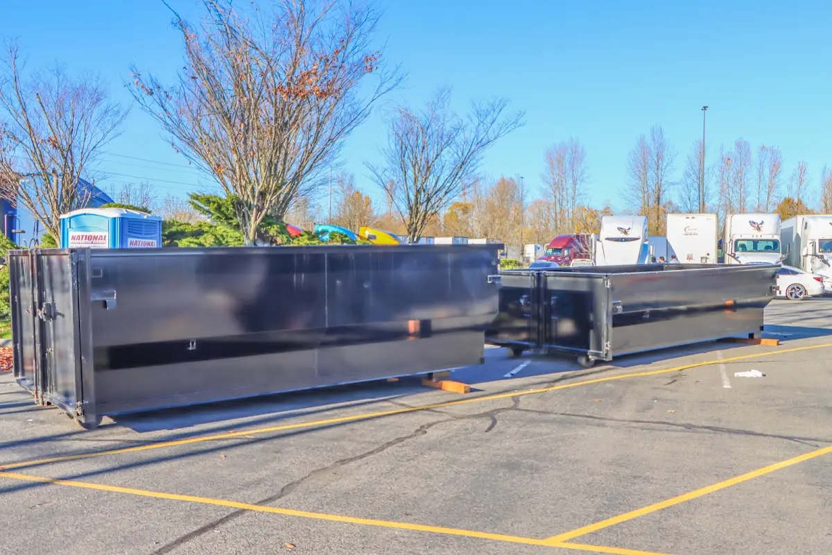 Professional dumpster rental service with roll-off container on residential driveway in Park Ridge